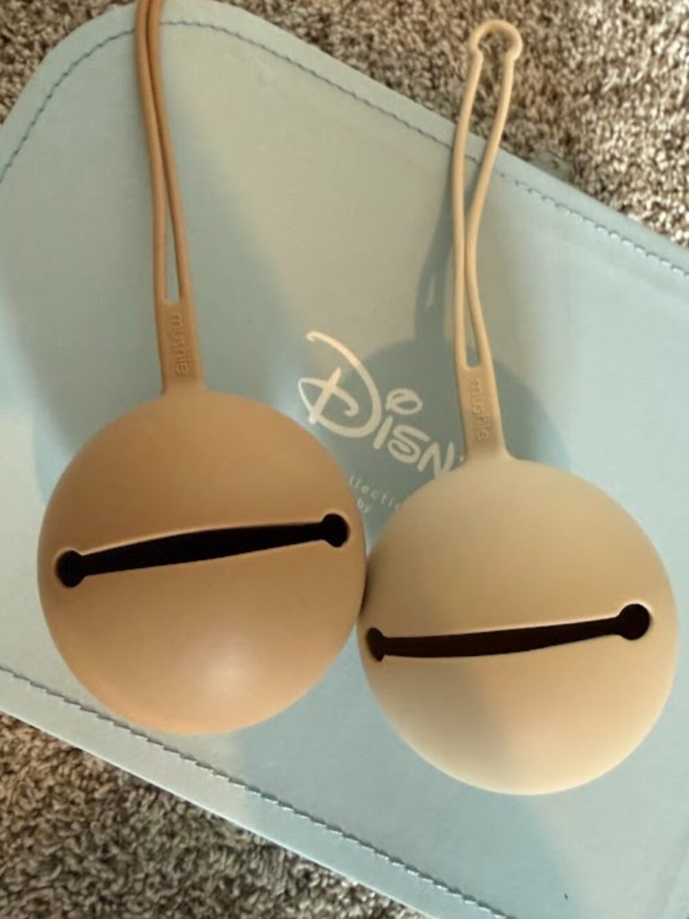 Two Neutral Mushie Silicone Pacifier Cases
